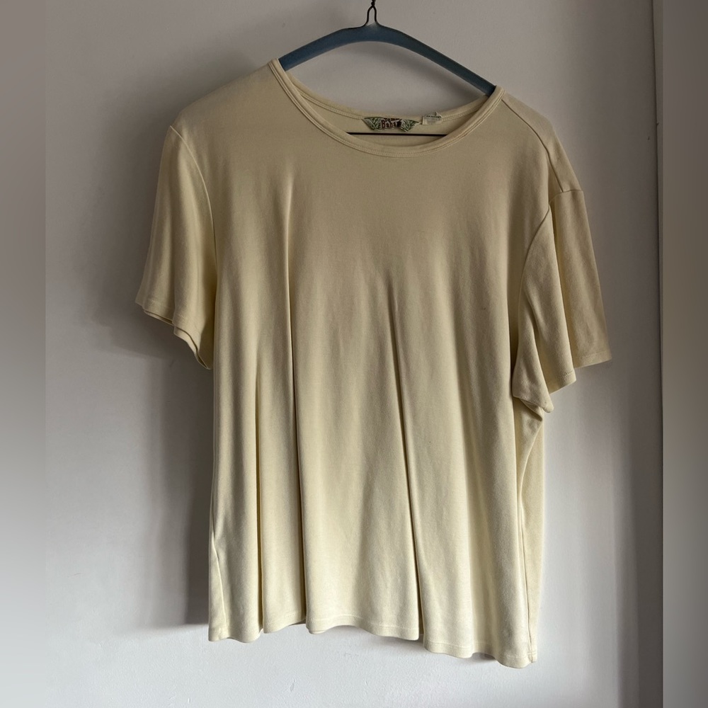 Tommy bahama t shirt for women XL. It’s a light yellow color